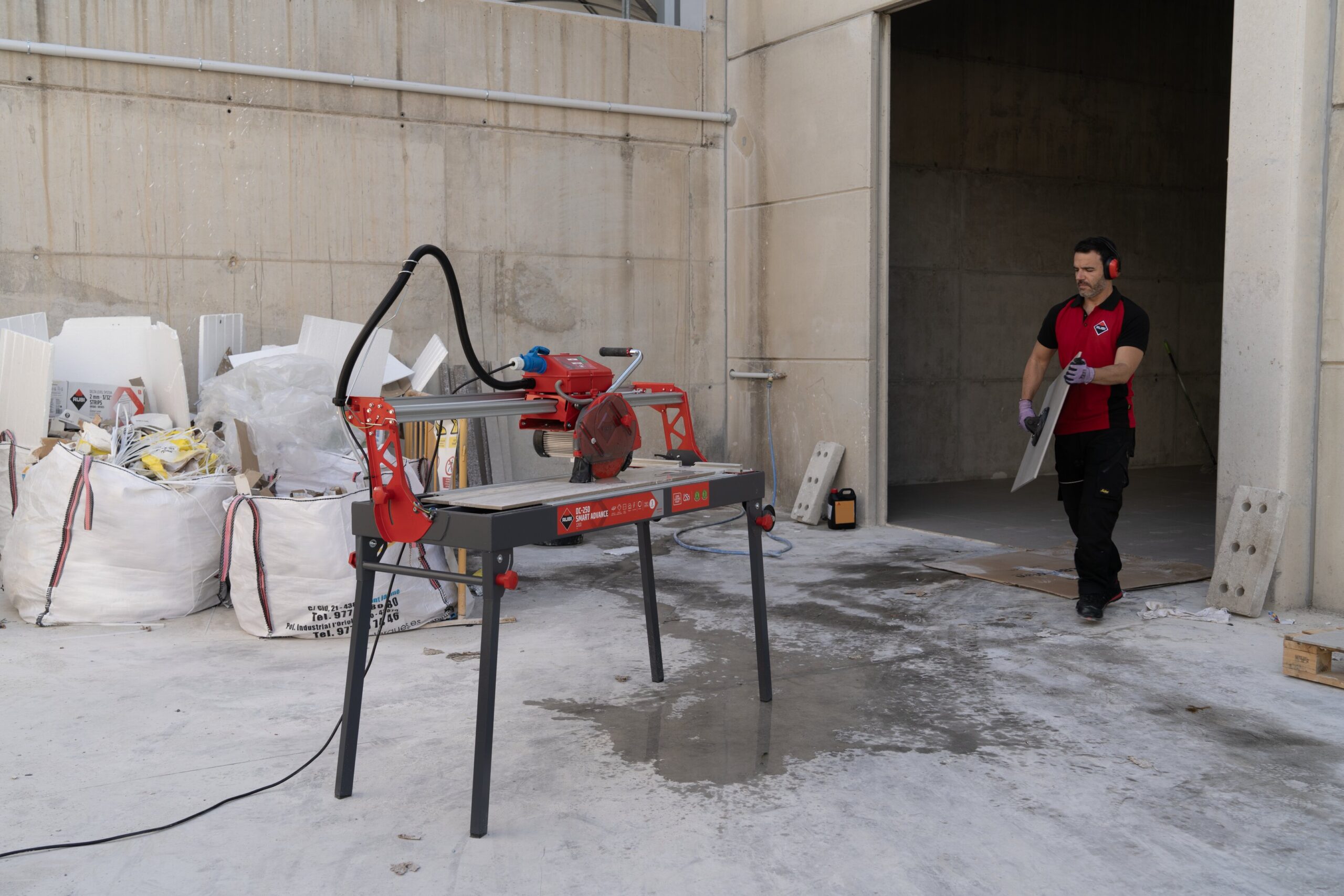 Manual tile cutter in use
